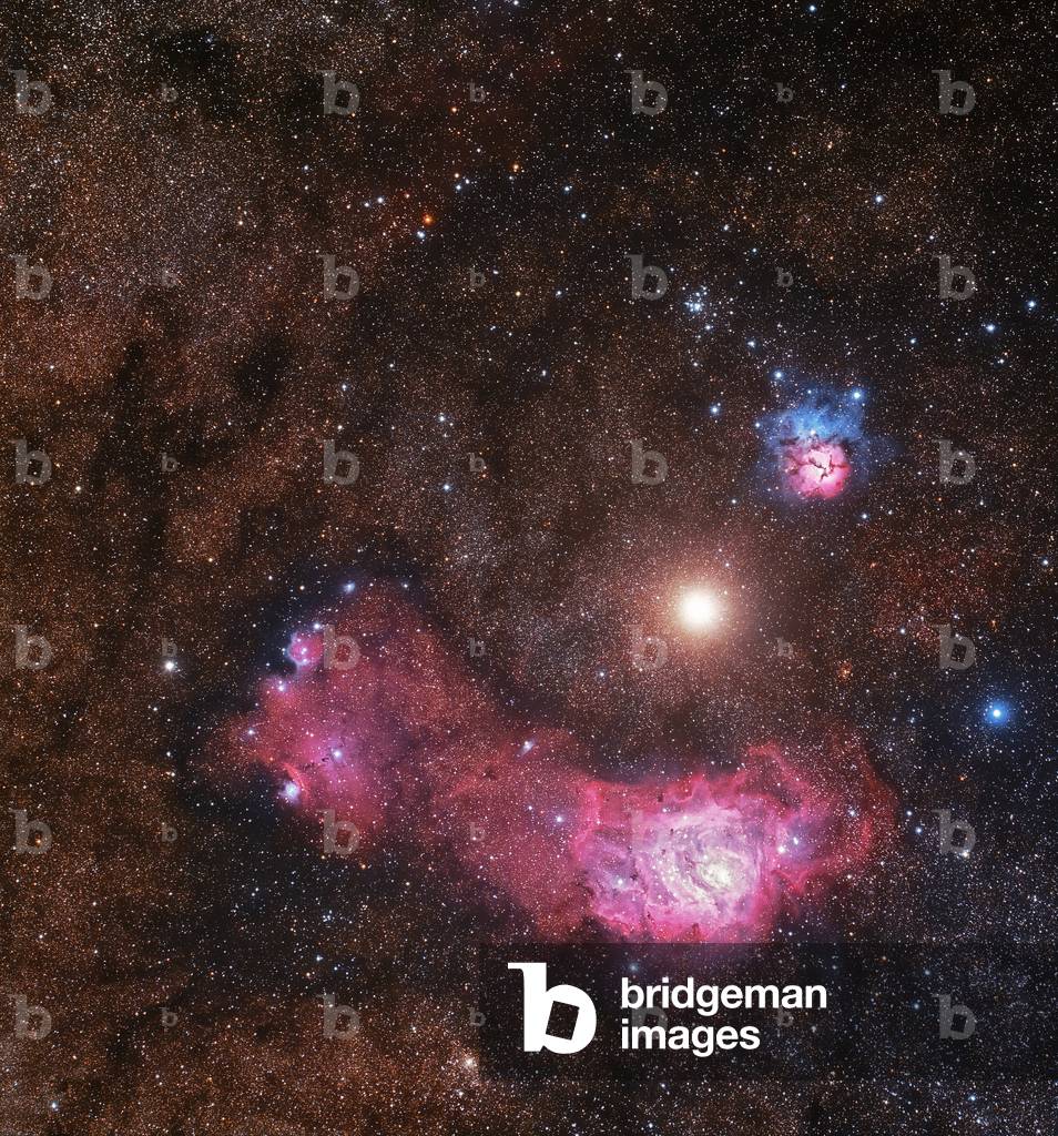 Planet Mars between the nebulae of the Lagoon (M8/NGC 6523), below, and Trifide (M20), at the top, March 19, 2018.