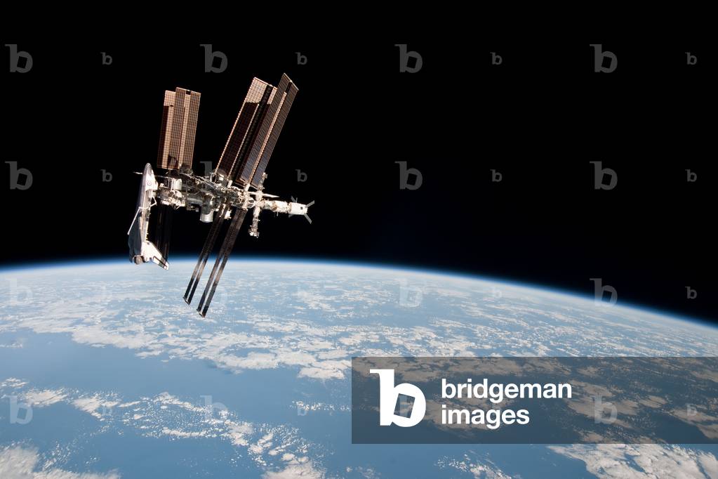 The International Space Station (ISS) and the Shuttle Endeavour 05/2011 - The Space Shuttle Endeavour docked to the International Space Station (ISS) 05/2011 - View of the Space Shuttle Endeavour moored at the International Space Station, from the Soyuz TMA spaceship - 20 on 23 May 2011. This series of images shows for the first time a shuttle moored to the space station from a Russian Soyuz spaceship. This image of the International Space Station and the docked Space Shuttle Endeavour, flying at an altitude of approximately 220 miles, was taken by Expedition 27 crew member Paolo Nespoli from the Soyuz TMA - 20 following its undocking on May 23, 2011 (USA time). The pictures are the first taken of a shuttle docked to the International Space Station from the perspective of a Russian Soyuz spacecraft. Onboard the Soyuz were Russian cosmonaut and Expedition 27 commander Dmitry Kondratyev; Nespoli, a European Space Agency astronaut; and NASA astronaut Cady Coleman. Coleman and Nespoli were both flight engineers. The three landed in Kazakhstan later that day, completing 159 days in space