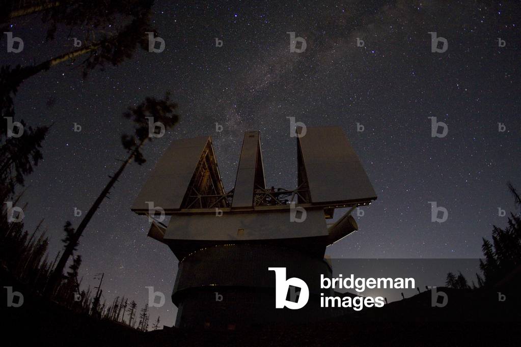 Large Binocular Telescope - Large Binocular Telescope - Summer lactee over the Large Binocular Telescope (LBT) on Mount Graham, Arizona. The LBT consists of two giant mirrors measuring 8.4m in diameter. Summer stars over the Large Binocular Telescope (LBT) on Mt. Graham in Arizona, USA. The giant observatory combines two side - by - side 8 - meter telescopes