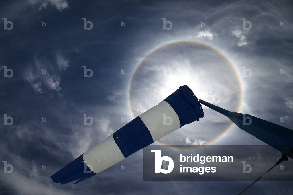 Halo around the Sun - Sun Halo - Halos are due to the light of the Sun reflected by high-altitude clouds, cirrostratus, composed of ice crystals. They bend the light and cause a perfect circle around the Sun. Halos are caused by sunlight being refracted by cirro - stratus clouds. These are thin clouds, very high in the atmosphere, and are composed of ice crystals. They bend light at a 22 degree angle, which creates a halo around the sun that is 44 degrees in diameter