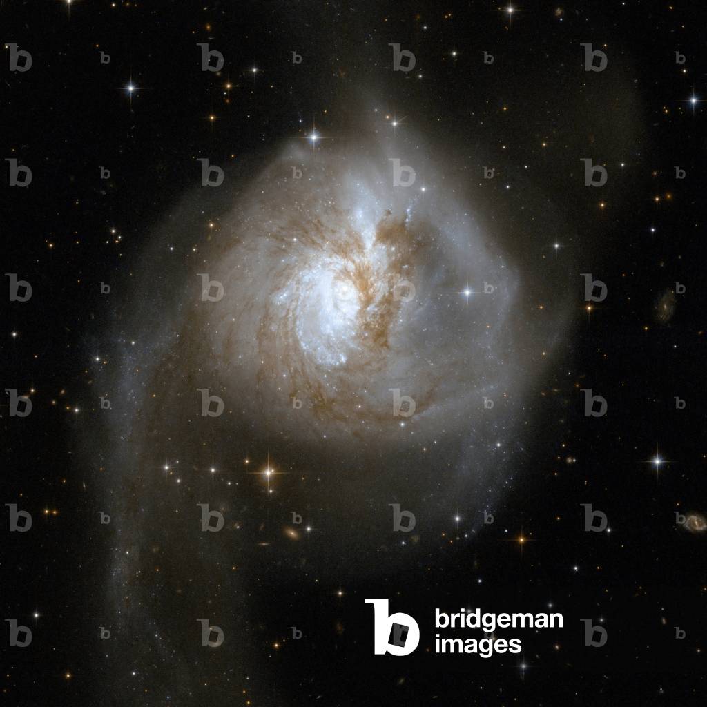 Interacting galaxies NGC 3256 - Interacting galaxies NGC 3256 - The special galaxy NGC 3256 is located about 100 million light years away from Earth in the southern constellation of Sails. A vestige of the collision of two galaxies, this system presents a double nucleus and many young clusters of stars. Image obtained by the Hubble Space Telescope on November 5, 2001. NGC 3256 is an impressive example of a peculiar galaxy that is actually the relict of a collision of two separate galaxies that took place in a distant past. The telltale signs of the collision are two extended luminous tails swirling out from the galaxy. NGC 3256 belongs to the Hydra - Centaurus supercluster complex and provides a nearby template for studying the properties of young star clusters in tidal tails. The system hides a double nucleus and a tangle of dust lanes in the central region. The tails are studded with a particularly high density of star clusters. Image taken by the Hubble space telescope on November 5, 2001