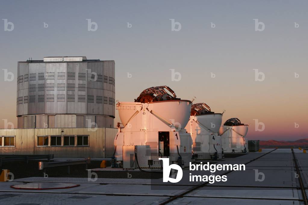 Paranal Observatory, Chile 03/2008 - Paranal Observatory, Chile 03/2008 - Yepun, one of the four 8.2m telescopes, and three of the four 1.8m auxiliary telescopes. March 2008. Paranal Observatory is an astronomical observatory located on the top of Cerro Paranal in the Atacama Desert in the northern part of Chile. This picture shows at left Yepun, one of the four 8,2m telescopes, with three auxiliary telescopes. March 2008