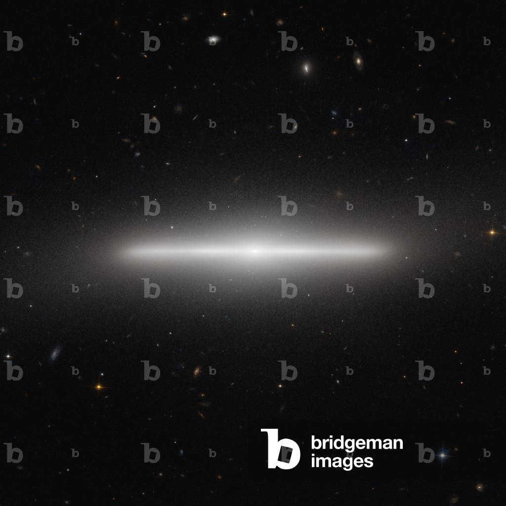 Spiral Galaxy NGC 4452 - Galaxy Spiral NGC 4452 - NGC 4452 is located about 60 million light years away from Earth in the galaxy cluster of Our Lady. Seen from the Earth, this spiral galaxy is presented by the slice, leaving only the thickness of its disc visible. Image obtained by the Hubble Space Telescope. The NASA/ESA Hubble Space Telescope has imaged a striking galaxy called NGC 4452, which appears to lie exactly edge - on as seen from Earth. The bright nucleus can be seen at the centre, along with the very thin disc that looks like a straight line from our unusual viewing position. To complete the picture, a hazy halo of stars on the periphery of the galaxy makes it seem to glow. NGC 4452 was first seen by William Herschel in 1784 with his 47 cm telescope in England. He described the object as a bright nebula, small and very much elongated. The new Hubble image shows just how elongated this unusual object really is. NGC 4452 is part of the Virgo Cluster, so - called because many of its members appear in the constellation of Virgo (the Maiden). This enormous grouping is approximately 60 million light - years distant and contains around 2000 galaxies. Large numbers of much more remote, faint galaxies, far beyond NGC 4452 and the Virgo Cluster, appear in the background of this image. This picture of NGC 4452 was created from images taken using the Wide Field Channel on Hubble's Advanced Camera for Surveys. This picture was made from images through blue (F475W, colored blue) and near - infrared (F850LP, colored red) filters. The exposures times were 750 s and 1210 s respectively. The field of view extends over 2.6 arcminutes