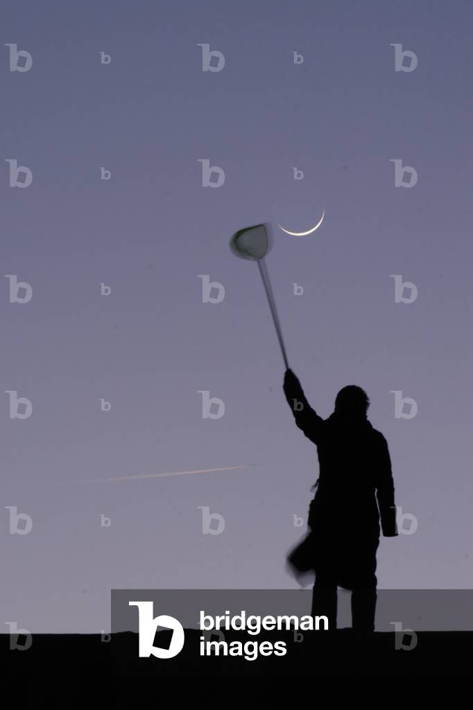Catching the Moon - To catch the Moon - First crescent of the Moon. March 20, 2007. Catching a first moon crescent with a fishing net. March 20, 2007