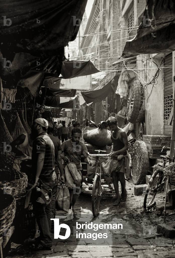 Market street scene, Kolkata, India (b/w photo)