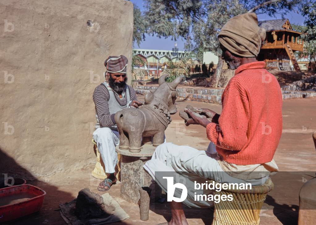 Craftsman from South India making deities for worship, folk art, Asia Fair 1972, Delhi, India (photo)
