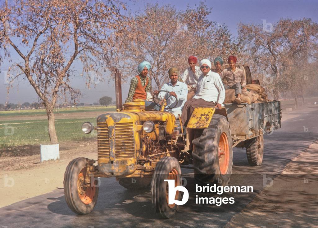 Sikhs driving tractor in the Punjab, India, 1973 (photo)
