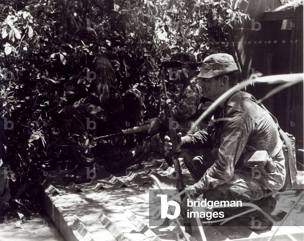 Members of a US Navy SEAL Team prepare to disembark from an Armored Troop Carrier (ATC) on the Mekong Delta during Operation Crimson Tide, December 1967 (b/w photo)