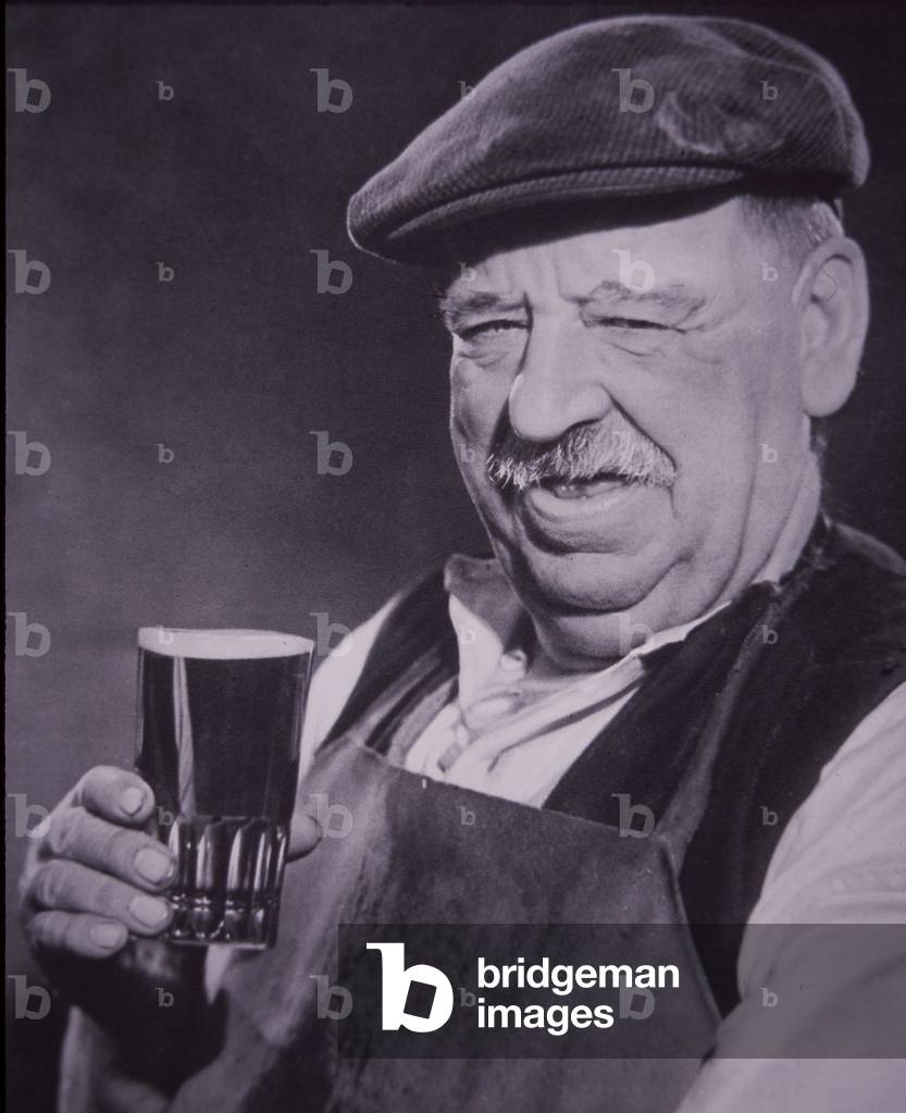 British workman drinking beer, c.1947 (b/w photo)