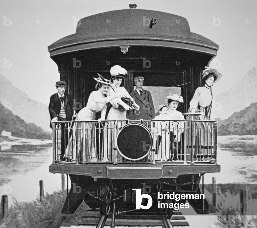 Tourists taking scenic photographs from the rear observation platform of a Union Pacific train, 1910 (b/w photo)