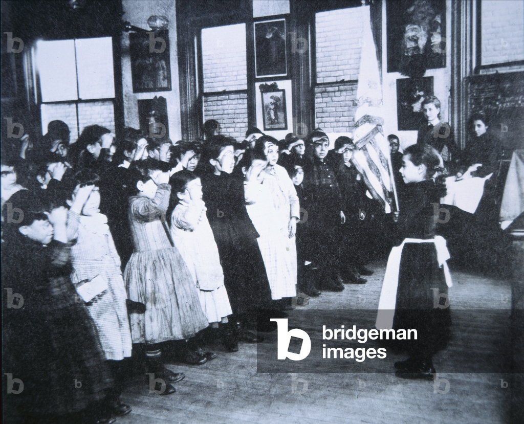 New young Americans salute the Flag in a New York City public school, c.1910 (b/w photo)