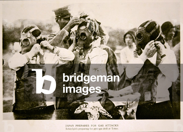 Japanese schoolgirls in Tokyo prepare for an anti-gas air attack drill, 1932 (b/w photo)