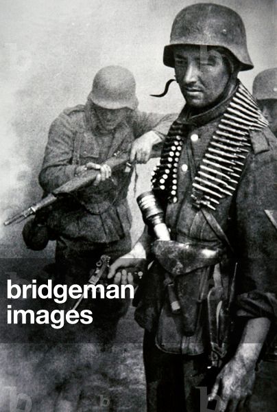 German infantry in combat: a man holding a Luger pistol carries and ammunition belt for the MG34/42; man behind carries a Kar 98k rifle (litho)