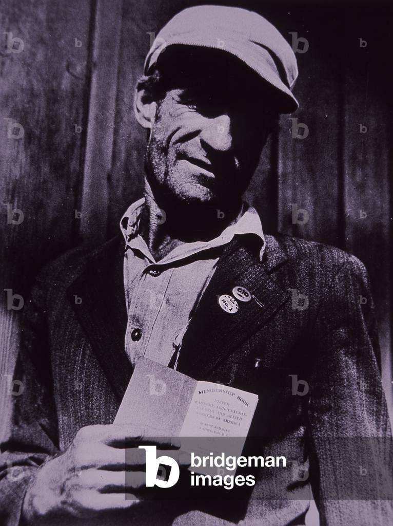 US worker shows his union card, c.1935 (b/w photo)