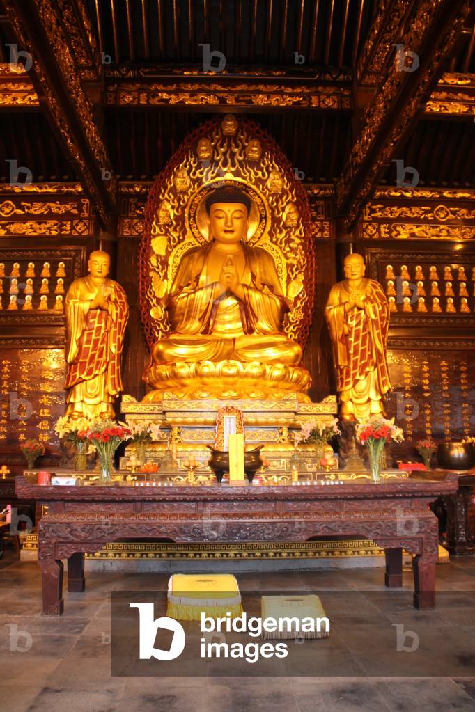 Inside Buddhist temple at Big Wild Goose Pagoda Temple complex, Xi’an, China (photo)