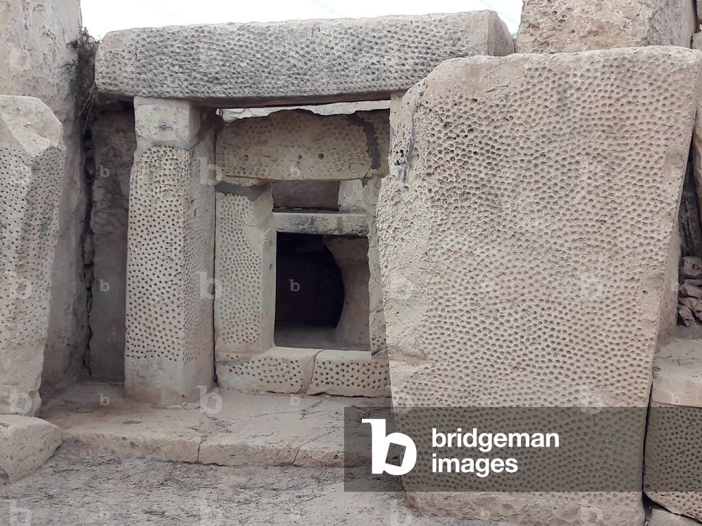 Decorated stone of the neolithic Hagar Qim temple, Malta (photo)