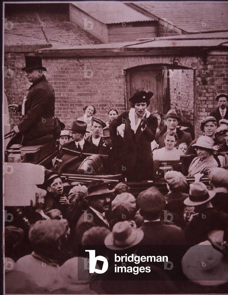 Lady Astor, first woman to take her seat as a Member of Parliament, campaigning for office, 1939 (b/w photo)