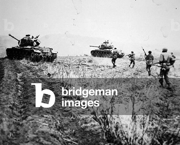 Americans of the 3rd Ranger Company, 3rd Infantry Division advance into close contact action, 11th April 1951 (b/w photo)