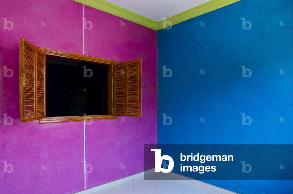 Brown-shuttered open window in multi-coloured wall, Souss River Valley, near Taroudant, Souss-Massa-Draa Region, Morocco (photo)