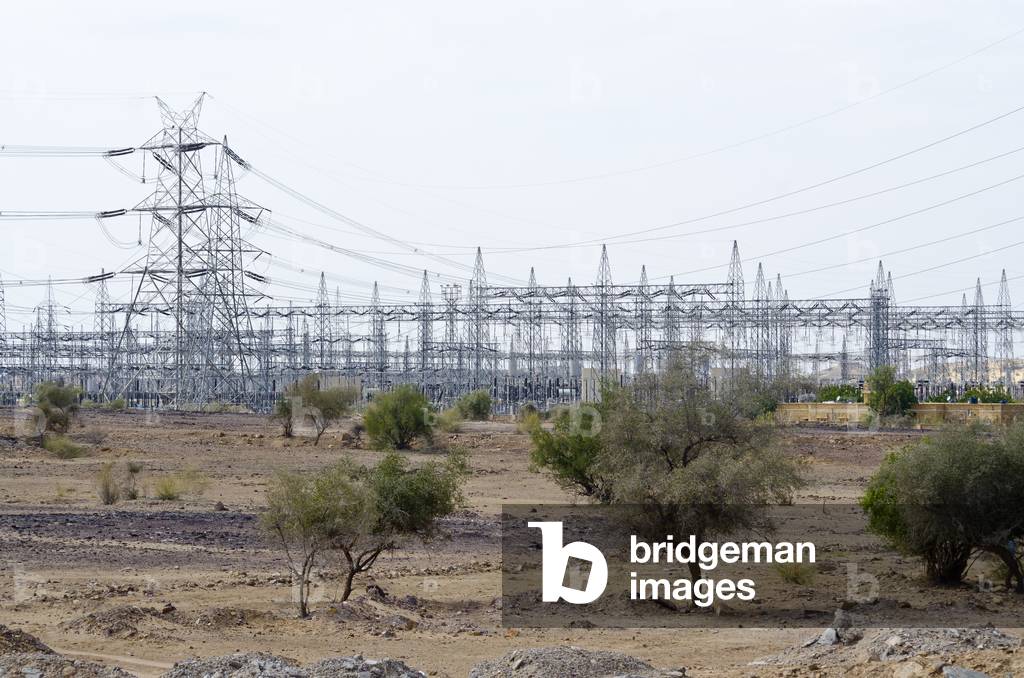 Pylons and power lines at electrical substation for wind farm in Thar Desert, between Jaisalmer and Barmer, Rajasthan, India (photo)