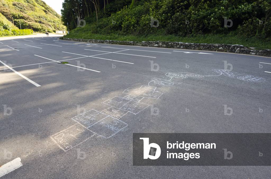 Children's chalked Hopscotch ground laid out in closed car park during Corona virus pandemic, Gower, South Wales, United Kingdom, 2020 (photo)