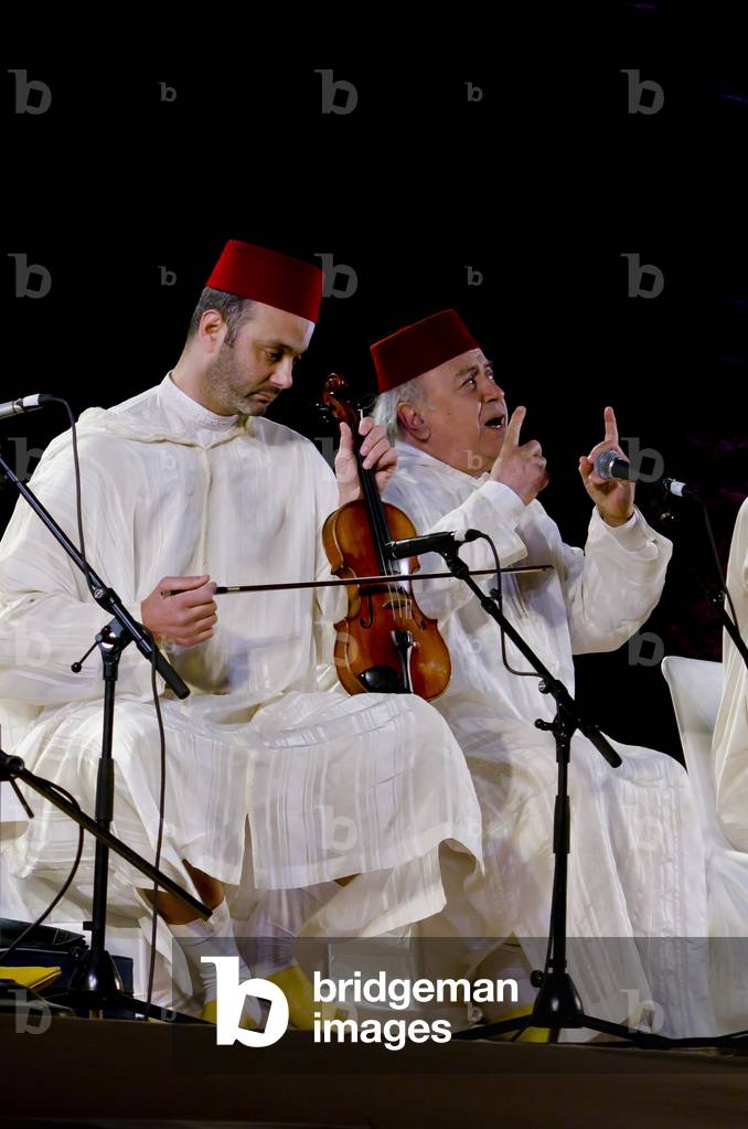 Moroccan singer & violin player in the Chabab Al Ensemble performing Arabic Andalusian music at the World Sufi Spirit Festival 2014,
Mehrangarh Fort, Jodhpur, Rajasthan, India (photo)