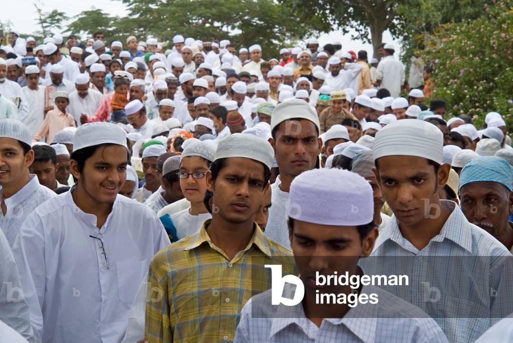 Muslim men returning from congregational prayers outside mosque (photo)