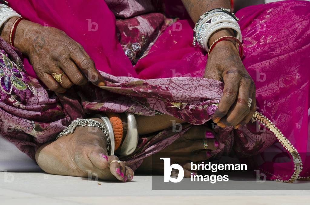 Hands and feet of Rajasthani woman in colourful dress, 
Jodhpur, Rajasthan, India (photo)