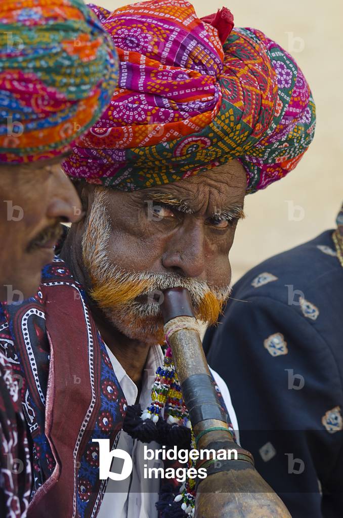 Pungi wind instrument player in a group of musicians from the Jaisalmer Jogi community/caste, World Sufi Spirit Festival 2014,
Mehrangarh Fort, Jodhpur, Rajasthan, India (photo)