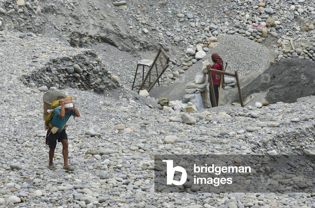Nepali couple manually strip mining, sifting & grading small plot of river valley, Seti Gandaki River Gorge, Pokhara, Nepal (photo)