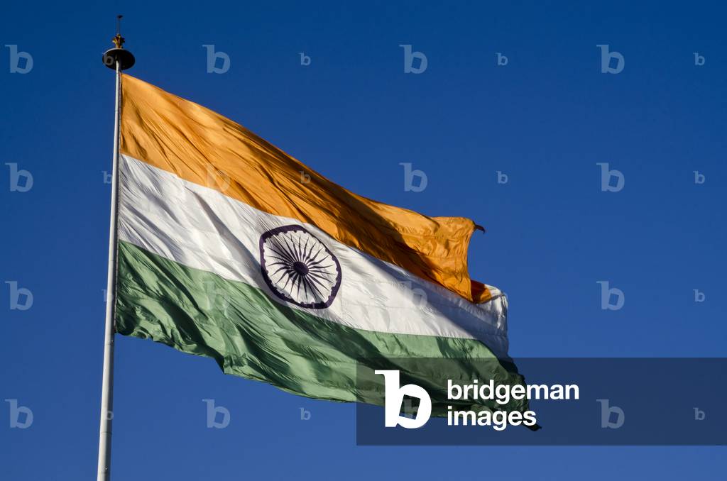 Large National Flag of India billowing in wind, Connaught Place, New Delhi, India (photo)