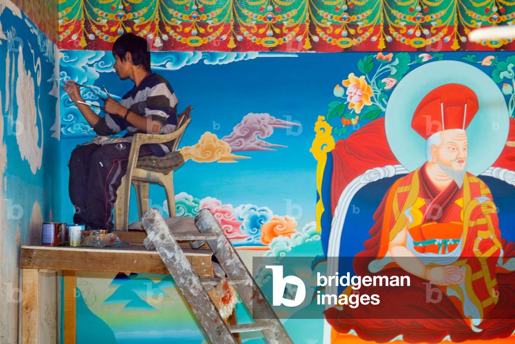 Tibetan Buddhism (Tantric B., Vajrayana): Traditional artist painting interior of Naropa Potang temple with scenes from Drukpa lineage, Shey, Ladakh, Jammu and Kashmir, Himalayas, India (photo)