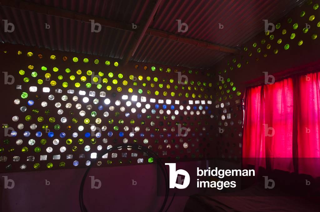 Interior of simple Bottle House in Nepali village, built after 2015 earthquake, Gwaldaha, Dakshinkali, Kathmandu Valley, Nepal (photo)