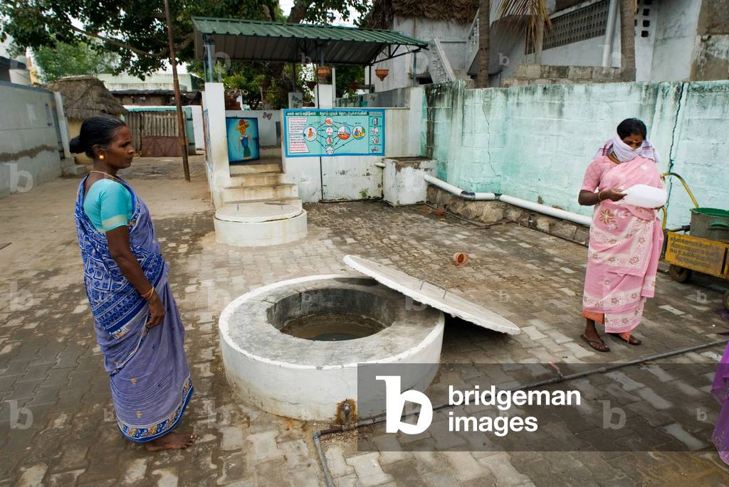 Underground Biogas Settler in DEWATS with children toilets in the background (photo) 

