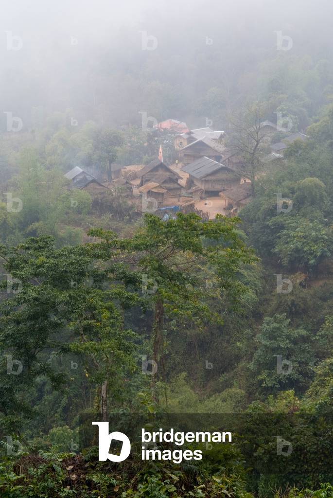 Remote ethnic minority Khmu village on slopes of montane tropical forest (rainforest) in the Annamite Range, mist and rain,
Ban Kabo, Nonghet District, Xieng Khouang Province, Laos, Southeast Asia