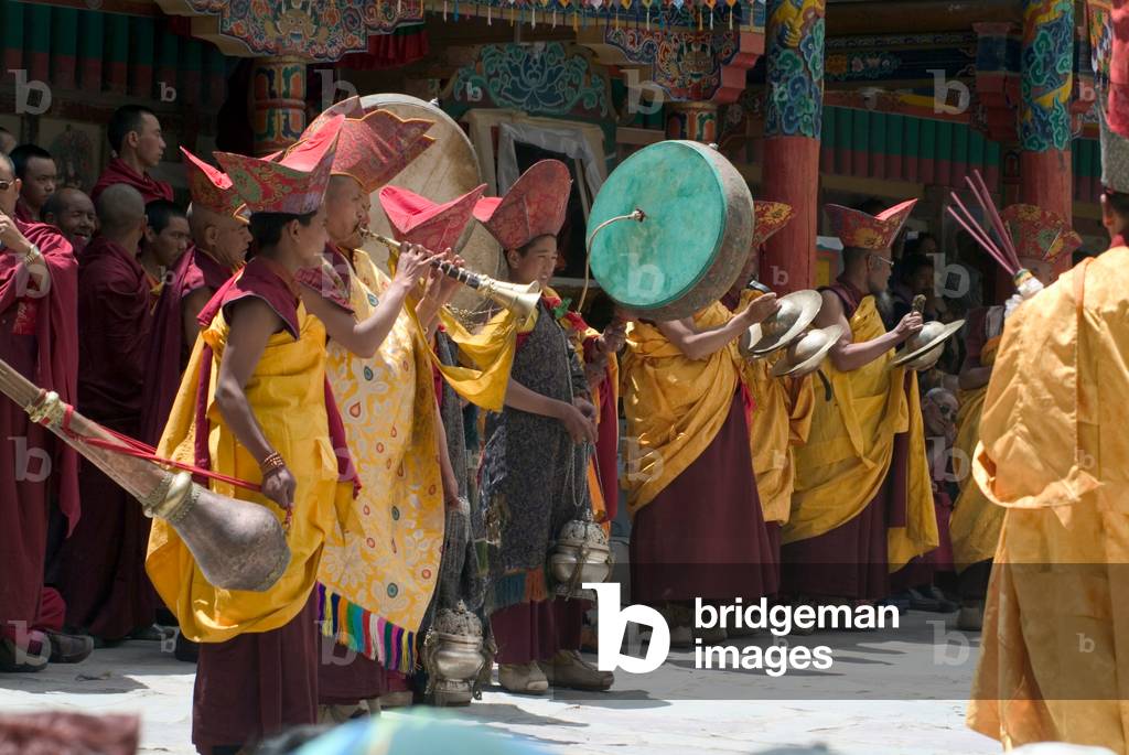 A monastic orchestra accompanying masked dancers at the annual Tshechu festival, Hemis Monastery, Ladakh (photo)