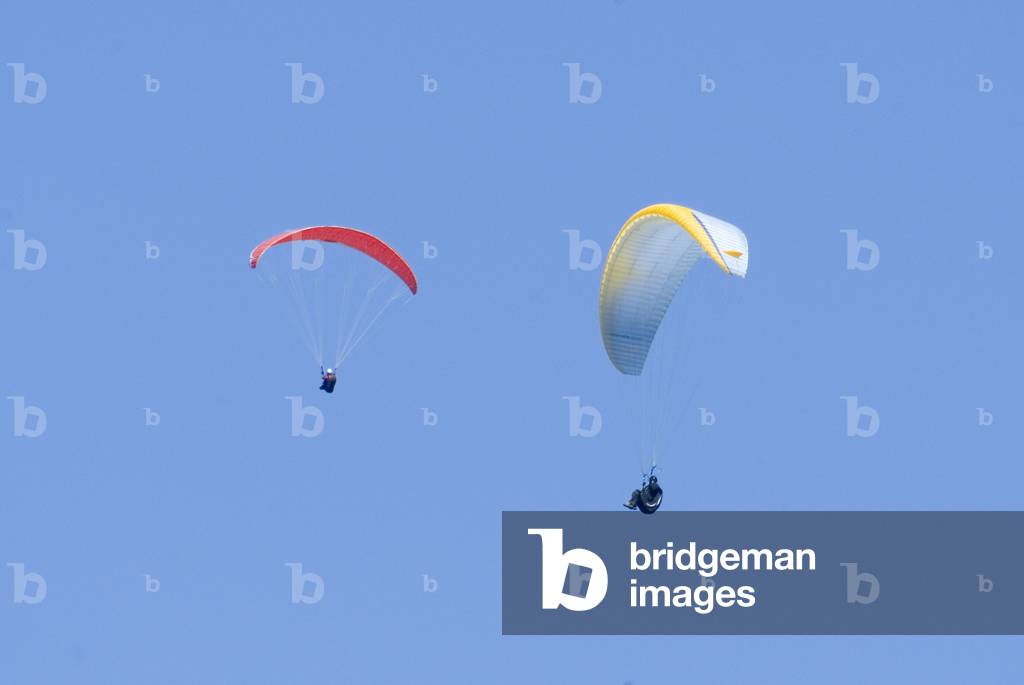 Paragliders in blue sky, Rhossili Downs, Gower, South Wales, UK (photo)