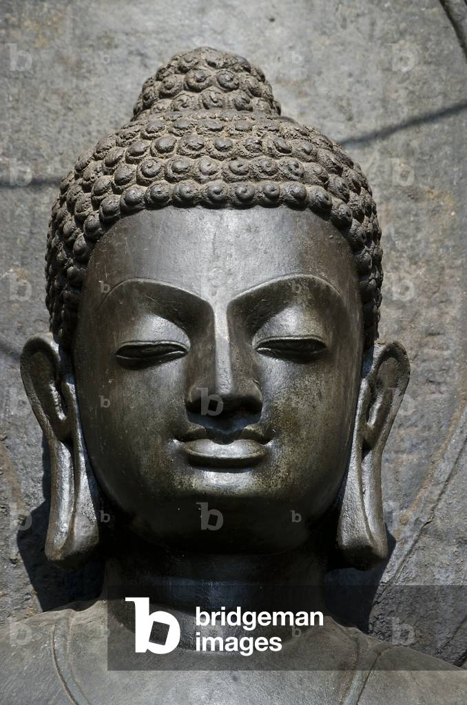 Head of black Shakyamuni Buddha statue, 7th century, said to be image of Siddharta Gautama, Swayambhu (aka. Monkey Temple), Kathmandu, Nepal (photo)