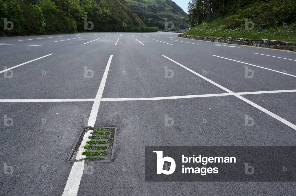 Closed car park with blocked, grassy drain in countryside during Corona virus pandemic, Gower, South Wales, United Kingdom, 2020 (photo)