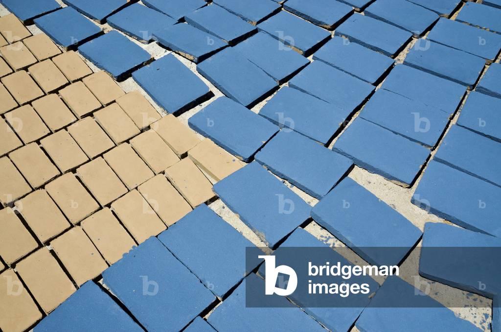 Glazed & unglazed clay tiles drying on ground in Berber village pottery, Riad, Taroudant Province, Souss-Massa-Draa Region, Morocco (photo)