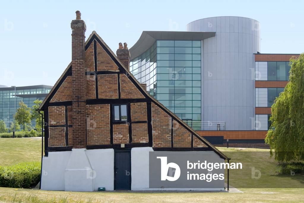 Historic timber-framed house in front of modern glass-and-steel office buildings, 
Reading International Business Bark, Reading, Berkshire, United Kingdom (photo)