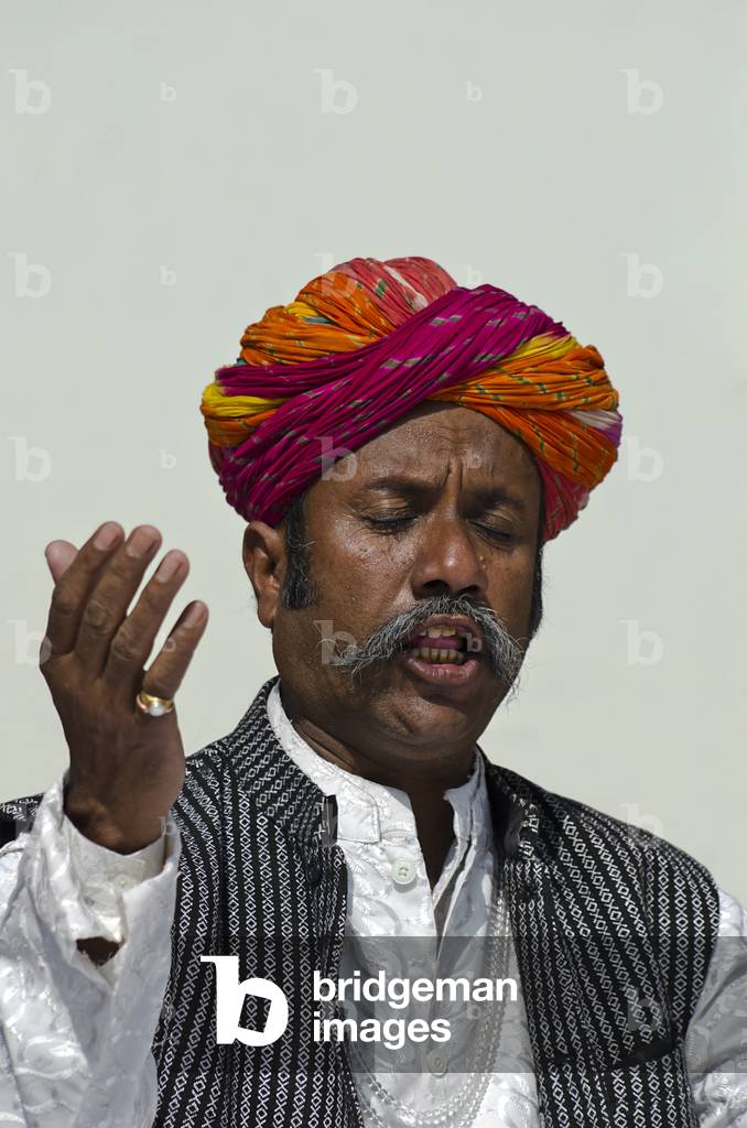 Multicolour-turbaned, moustachioed Rajasthani Sufi singer,
World Sufi Spirit Festival 2014,
Mehrangarh Fort, Jodhpur, Rajasthan, India (photo)