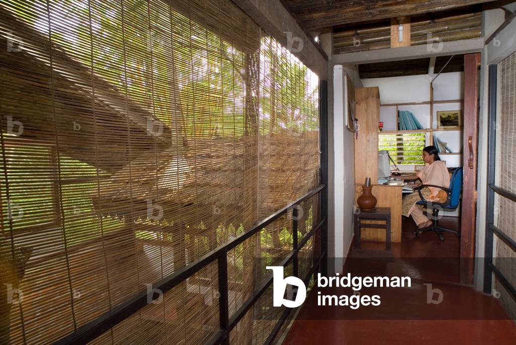 Indian architect in bamboo constructed offices integrated in a tropical forest (photo)
