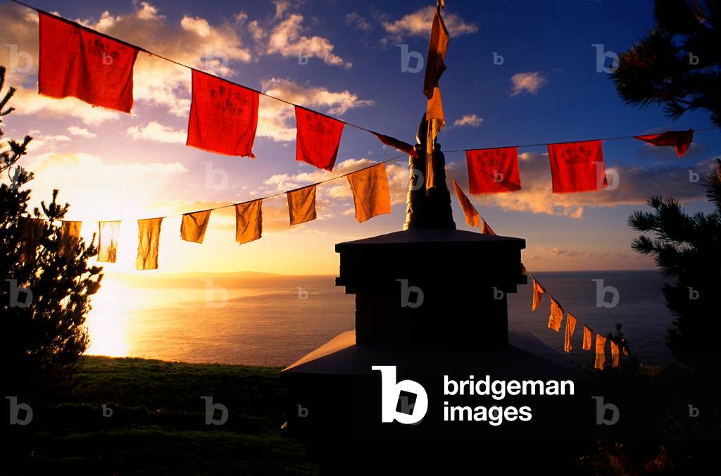 Tibetan Buddhist flags and stupa, at sunrise over Bantry Bay, Dzogchen Beara Tibetan Buddhist Retreat Centre, Garannes, Beara Peninsula, West Cork, Ireland (photo)