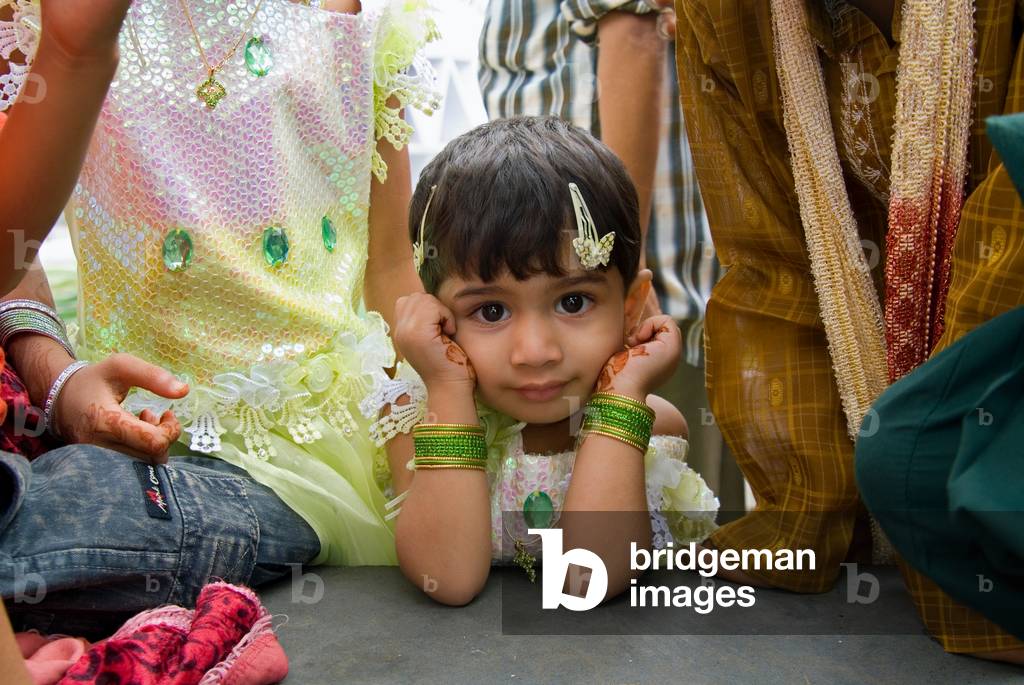 Islam: Young Muslim girl dressed up on occasion of Eid ul Fitr (end of Ramadan), Idgah Maidan, Mysore, Karnataka, India (photo)