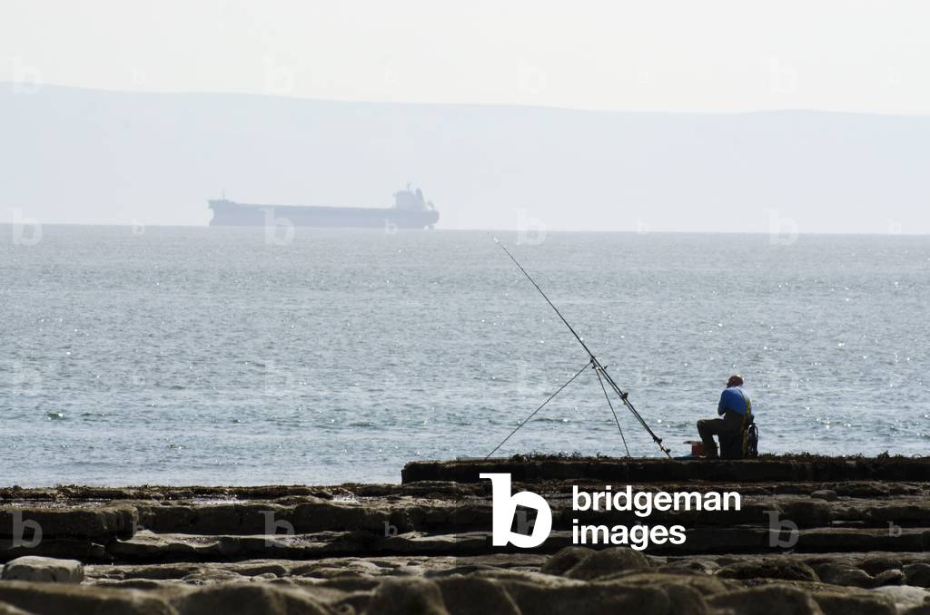 Glamorgan Heritage Coast: Sea Angler Fishing, near Nash Point, Vale of Glamorgan, West of Llantwit Major, South Wales, UK (photo)