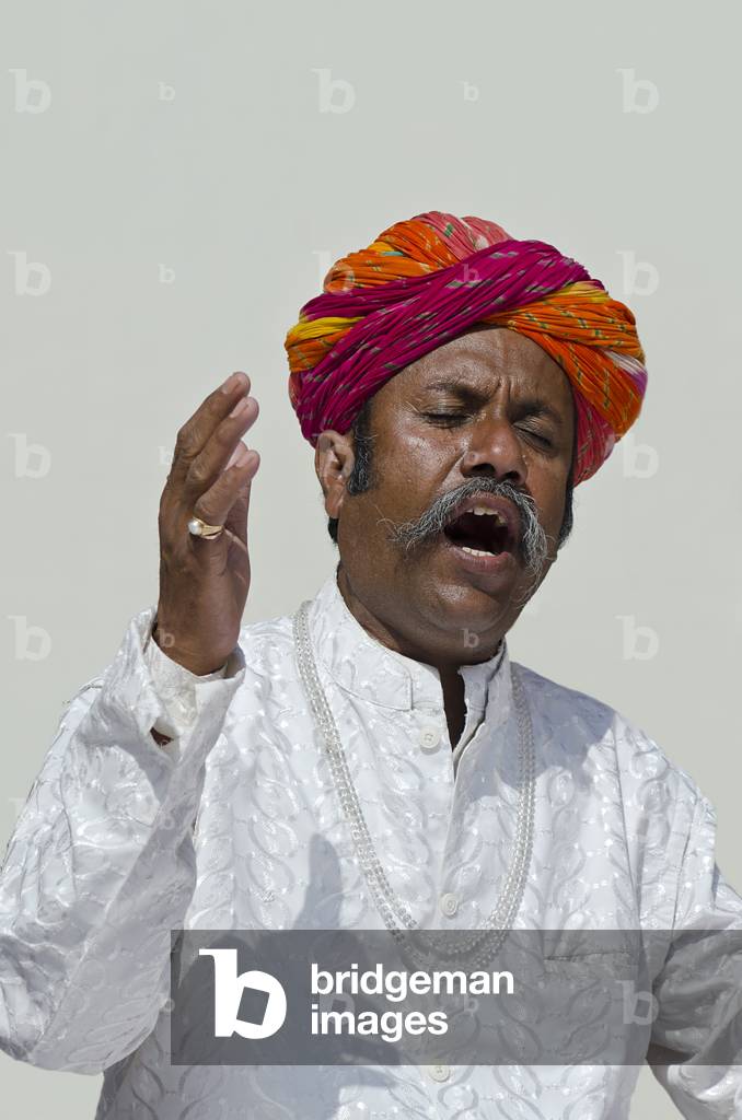 Multicolour-turbaned, moustachioed Rajasthani Sufi singer,
World Sufi Spirit Festival 2014,
Mehrangarh Fort, Jodhpur, Rajasthan, India (photo)