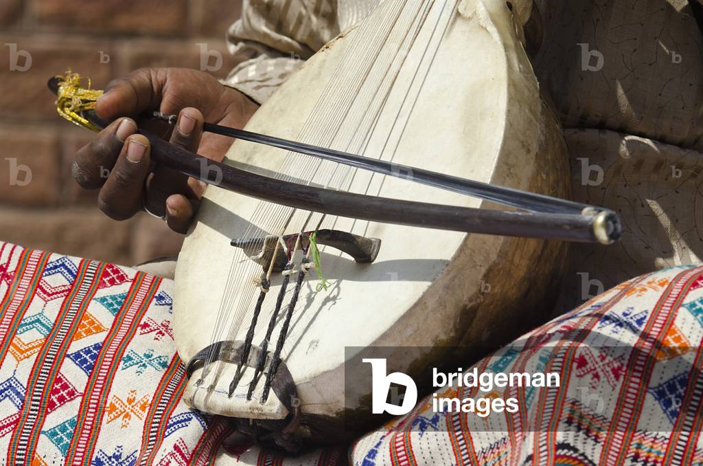 Indian musician playing a Kamaicha - one of the world's oldest bowed musical instruments,
World Sufi Spirit Festival 2014,
Mehrangarh Fort, Jodhpur, Rajasthan, India (photo)