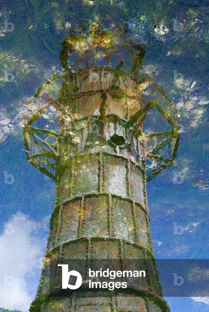 Disused Victorian cast-iron lighthouse reflected in rockpool, Whiteford Point, Loughor Estuary, Gower, South Wales, UK (photo)