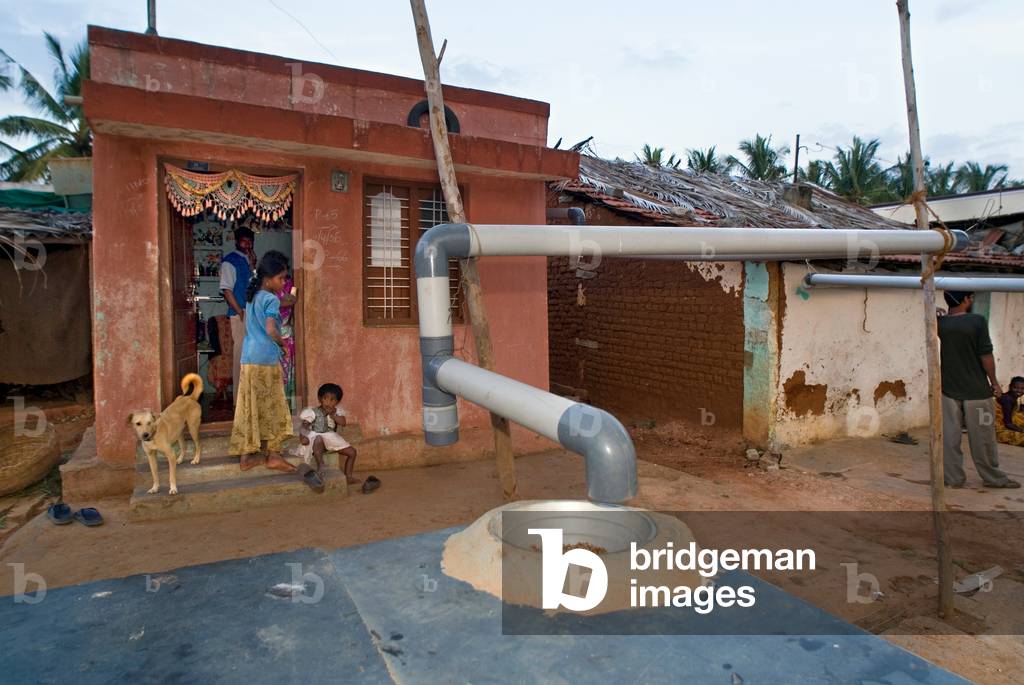 Rooftop rainwater harvesting system on village house, Kurubura Kunte, Karnataka, India (photo)
